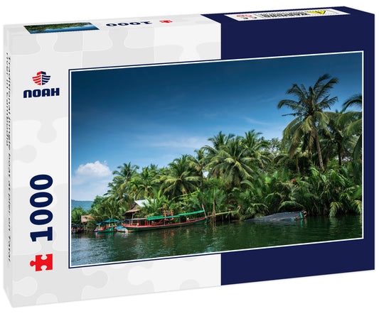 Traditional jungle boat at pier on Tatai river in Cambodia