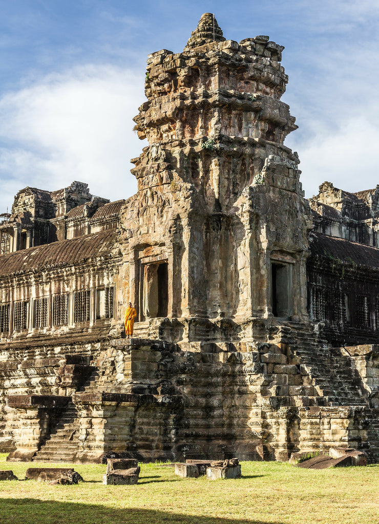 Young Buddhist monk standing at temple in Angkor Wat, Siem Reap, Cambodia