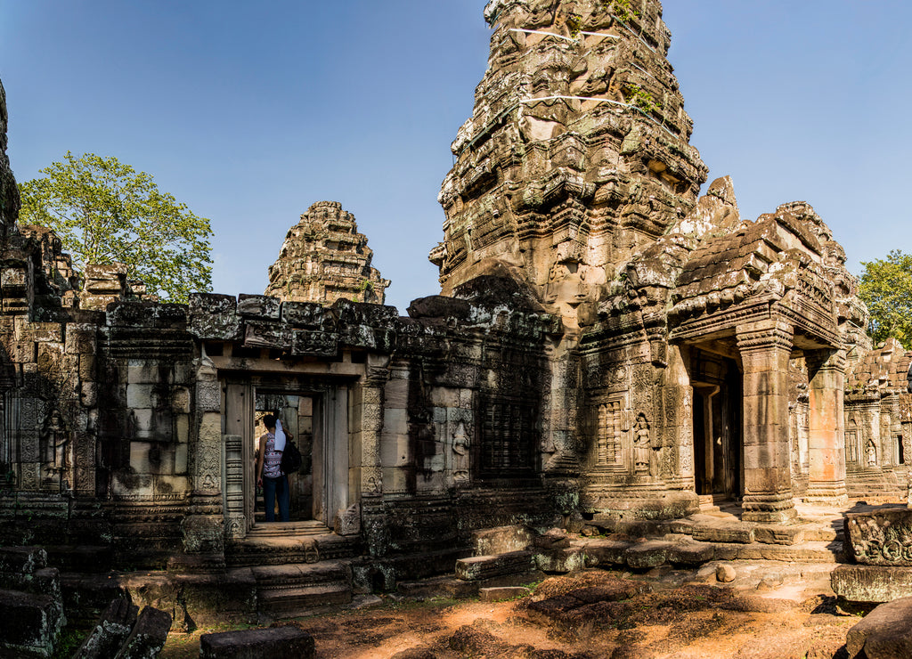 Man investigating Phimeanakas temple, Siem Reap, Cambodia