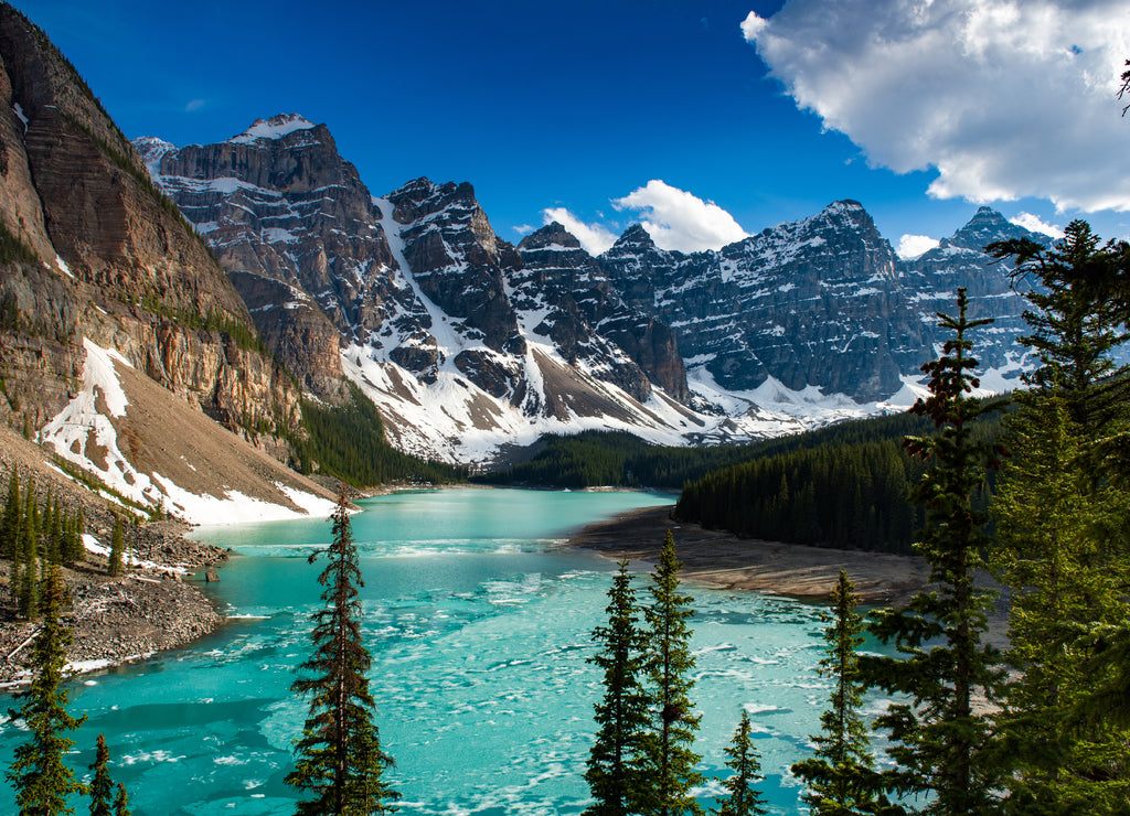 Turquoise water of Moraine Lake near sunset