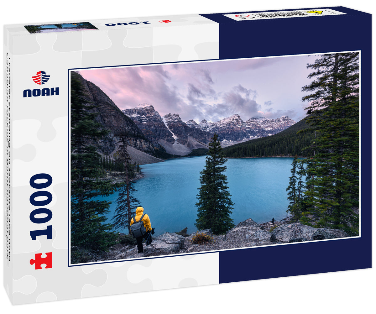 Traveler standing on Moraine lake with Canadian rockies in Banff national park