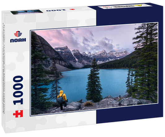 Traveler standing on Moraine lake with Canadian rockies in Banff national park