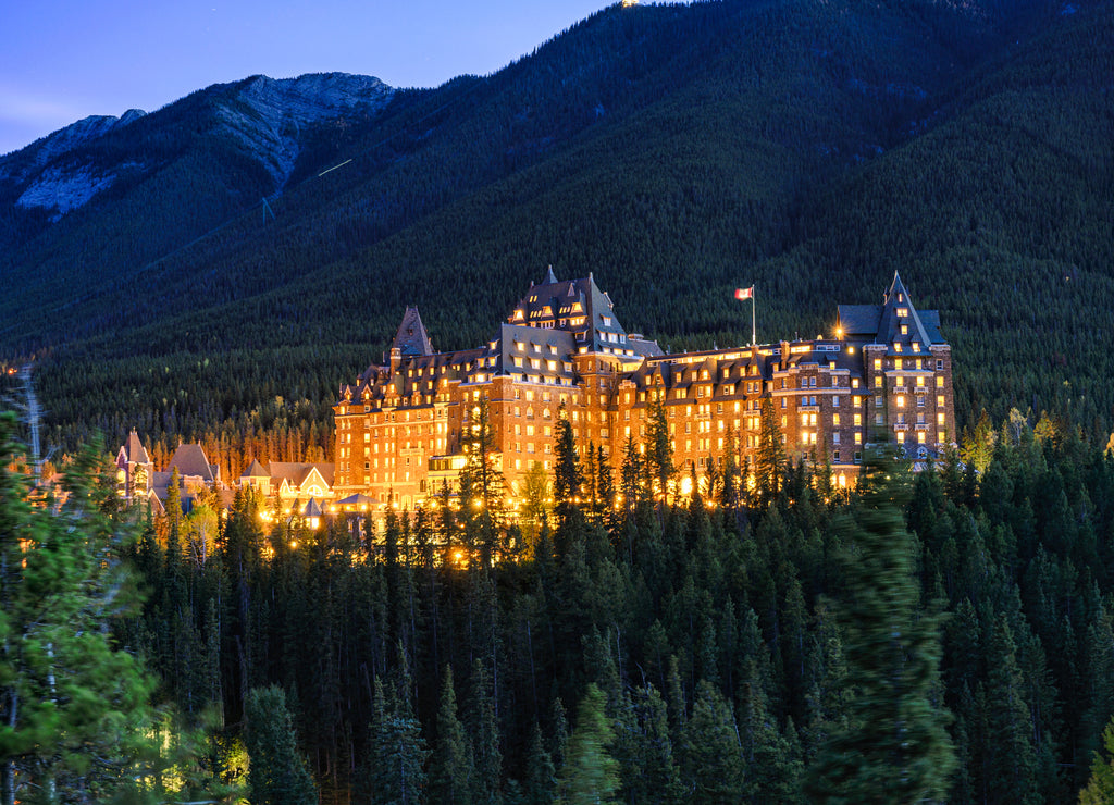 Fairmont banff springs luxury hotel with illumination in the canadian rockies at Banff national park