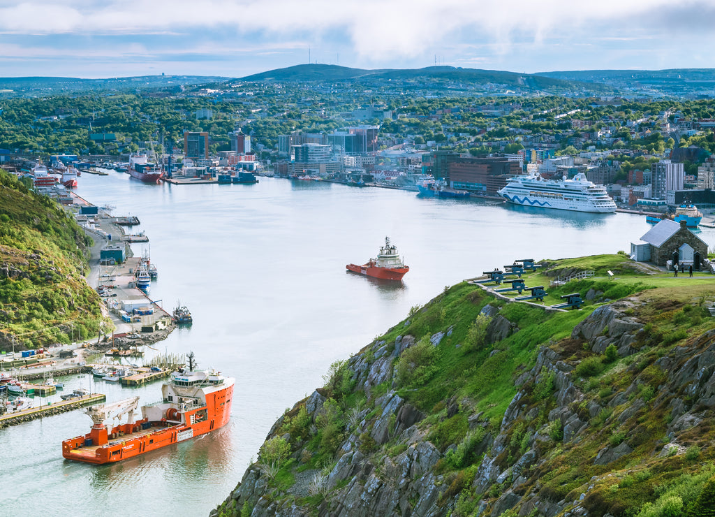 A boat passing trough The Narrow Waterway at Saint John, Newfoundland, Canada