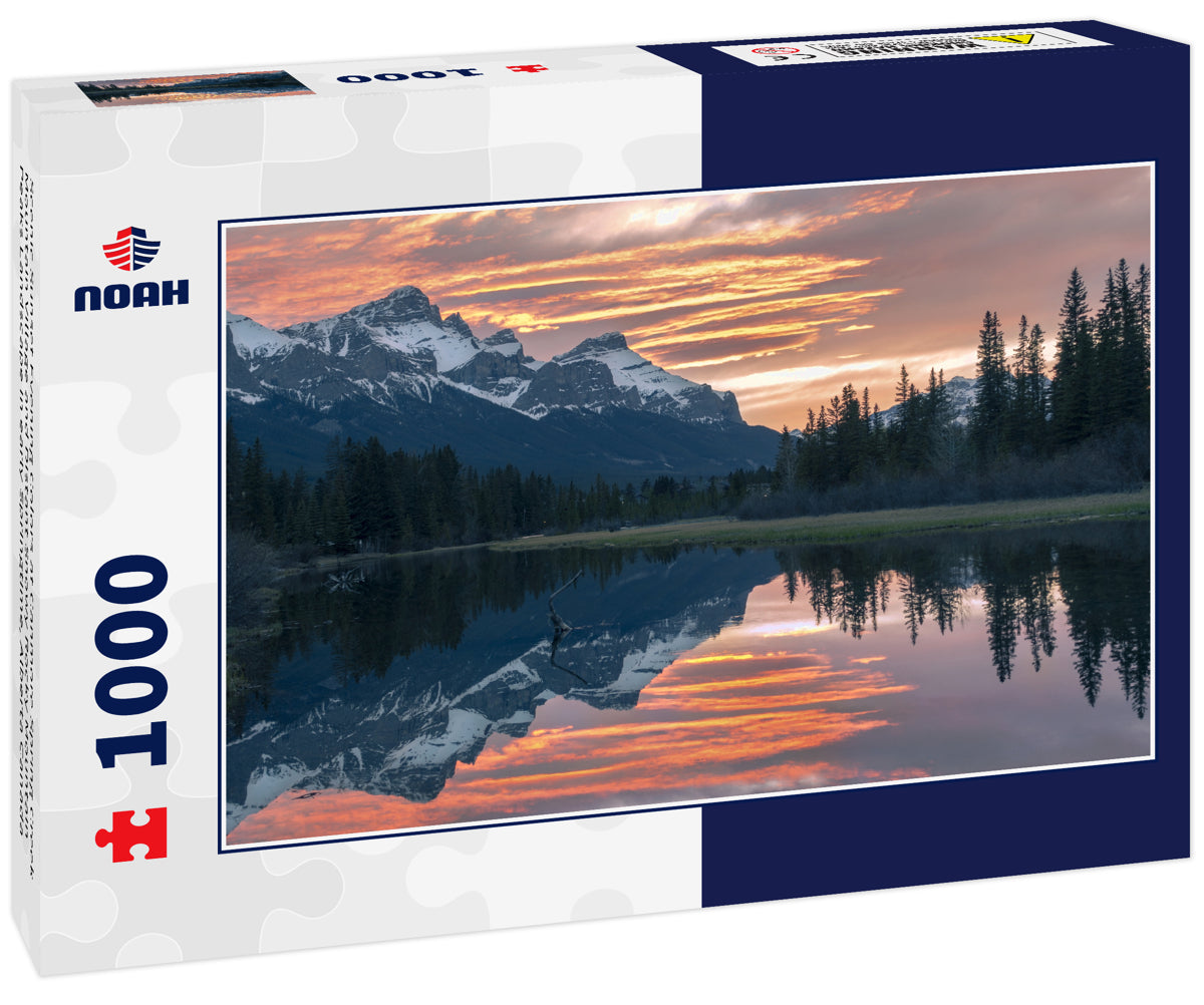 Scenic Sunset Evening Colors at Canmore Spring Creek Mountain Village and Distant Snowy Rocky Mountain Peaks Landscape in early Springtime, Alberta Canada