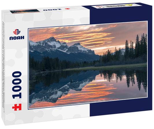 Scenic Sunset Evening Colors at Canmore Spring Creek Mountain Village and Distant Snowy Rocky Mountain Peaks Landscape in early Springtime, Alberta Canada