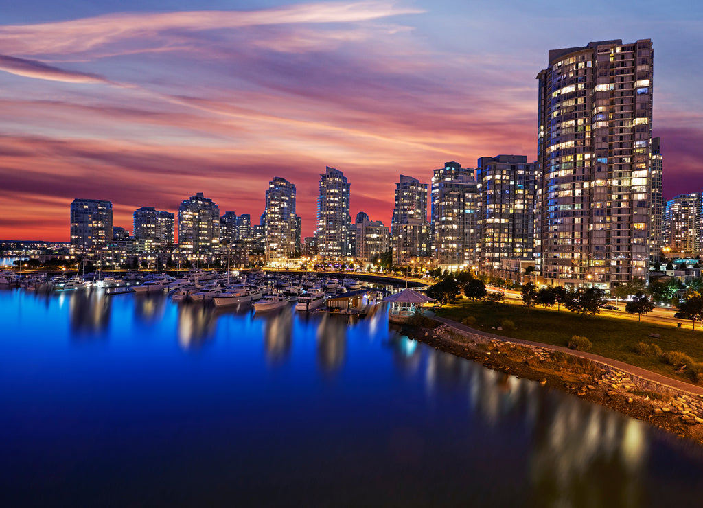 Skyline of apartments in Vancouver with red sunset sky at dusk