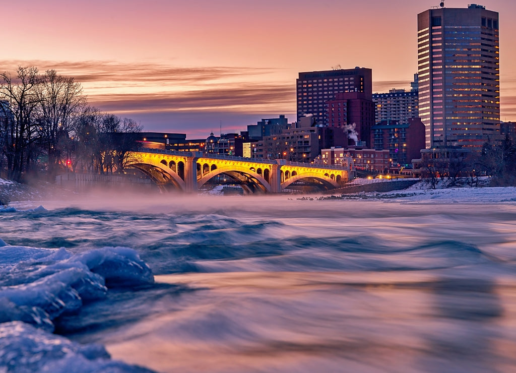 Sunrise Sky Glowing Over A Wintry Bow River By Downtown Calgary