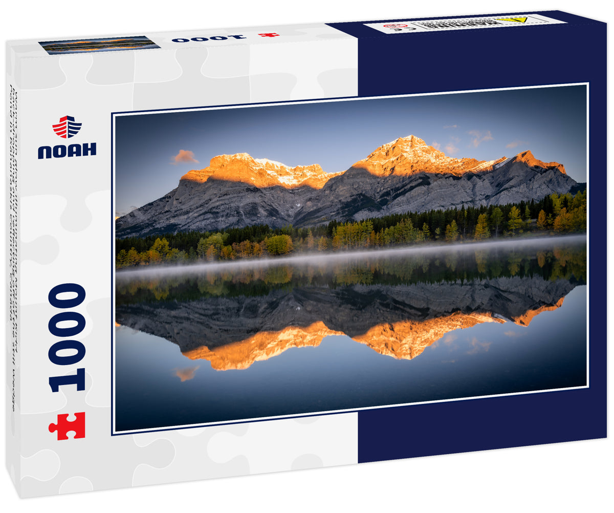 Warm sun glow illuminating Mount Kidd back-dropping and reflecting off of the still Wedge Pond in Kananaskis Country, Canada