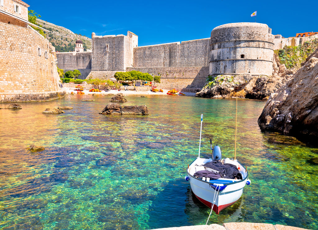 Small harbor under Dubrovnik city walls view