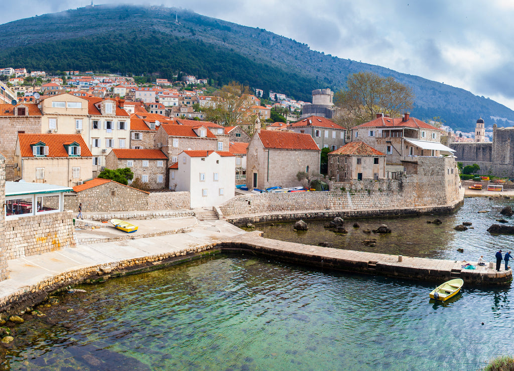 Panoramic view of Dubrovnik West Pier and medieval fortifications of the city seen from Fort Lovrijenac