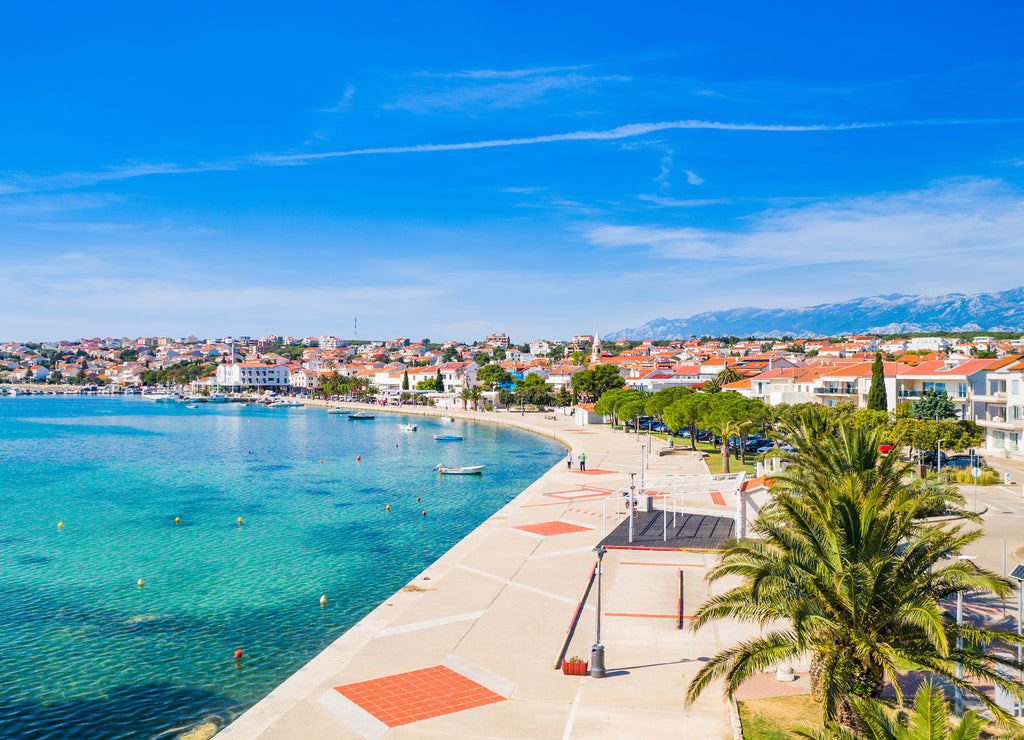 Croatia, beautiful Adriatic coastline, town of Novalja on the island of Pag, city center and marina aerial view from drone