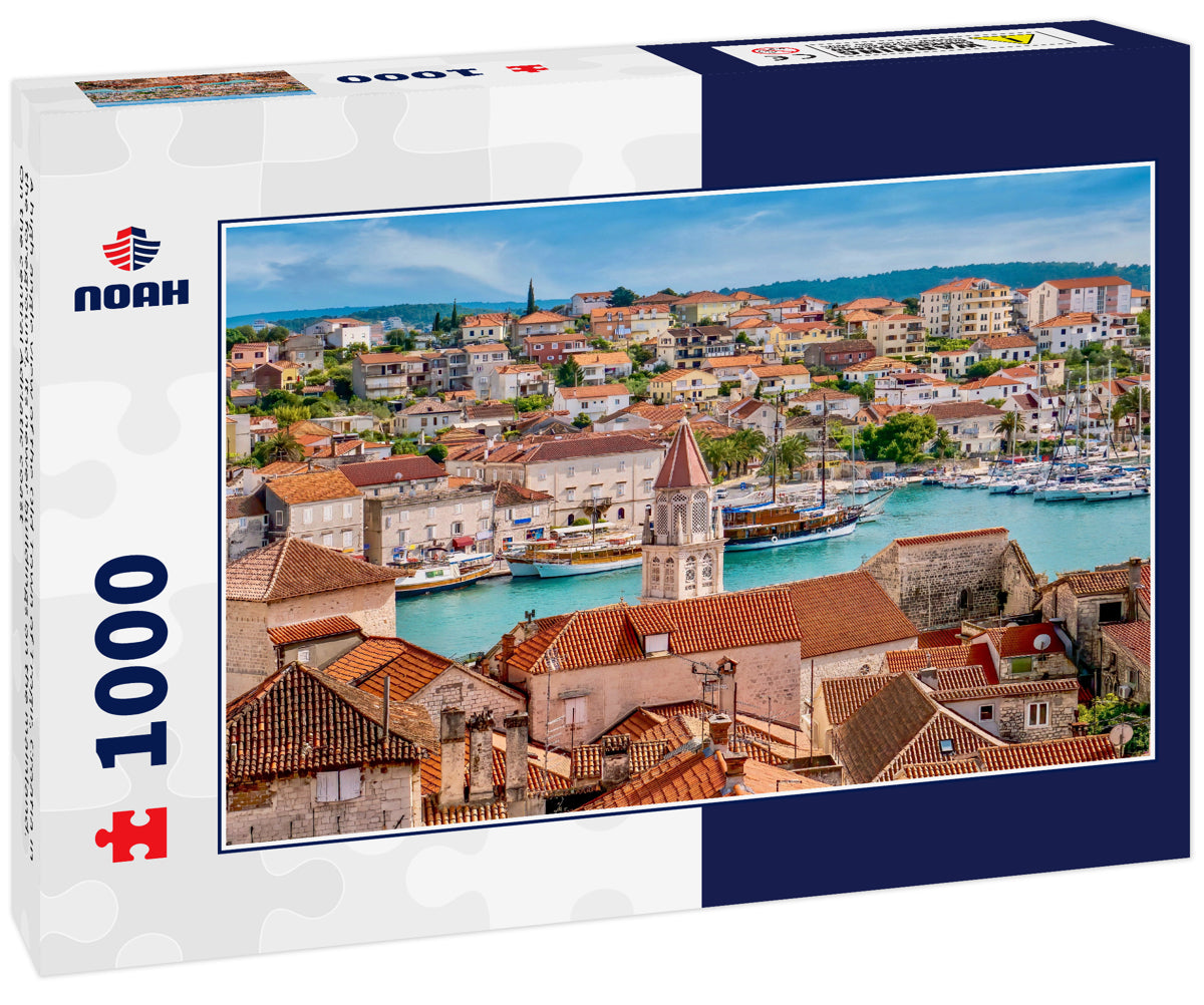 A high angle view of the Old Town of Trogir, Croatia in the foreground, its newer buildings on the mainland. On the central Adriatic coast