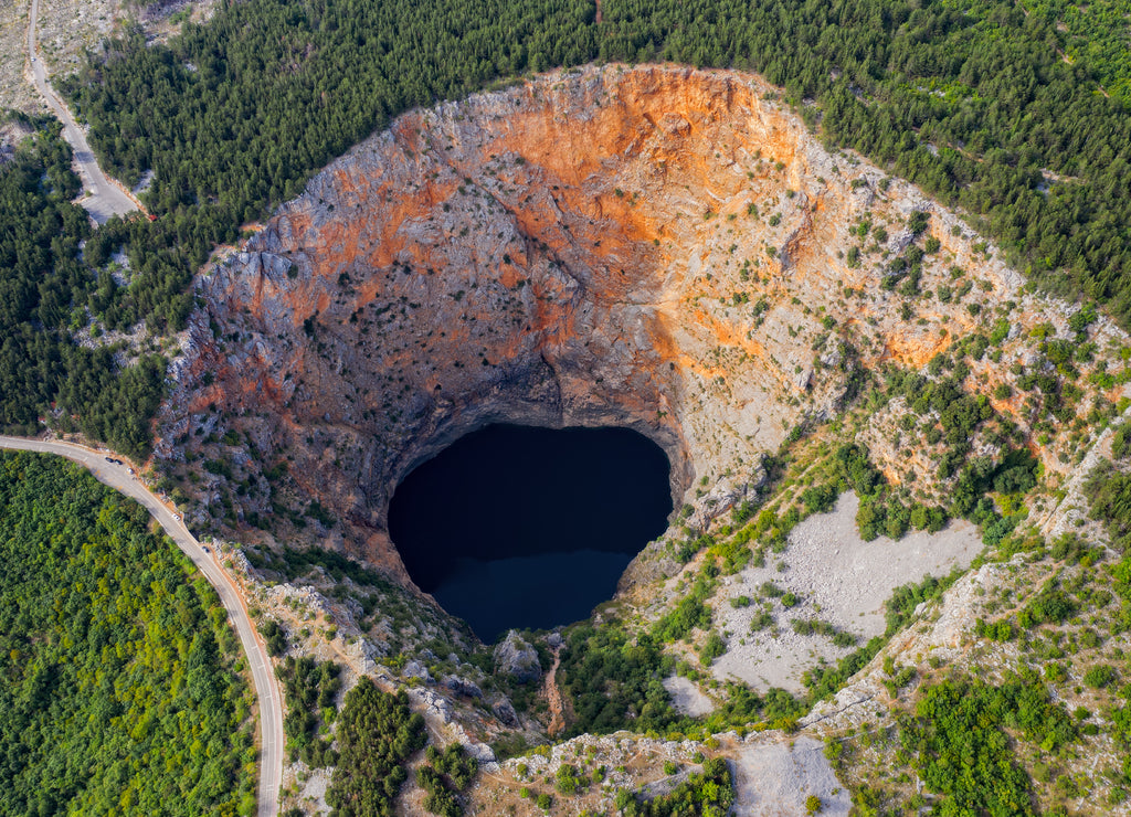 Red Lake Croatian: Crveno jezero is a collapse doline collapse sinkhole containing a karst lake close to Imotski, Croatia. It is 530 metres deep