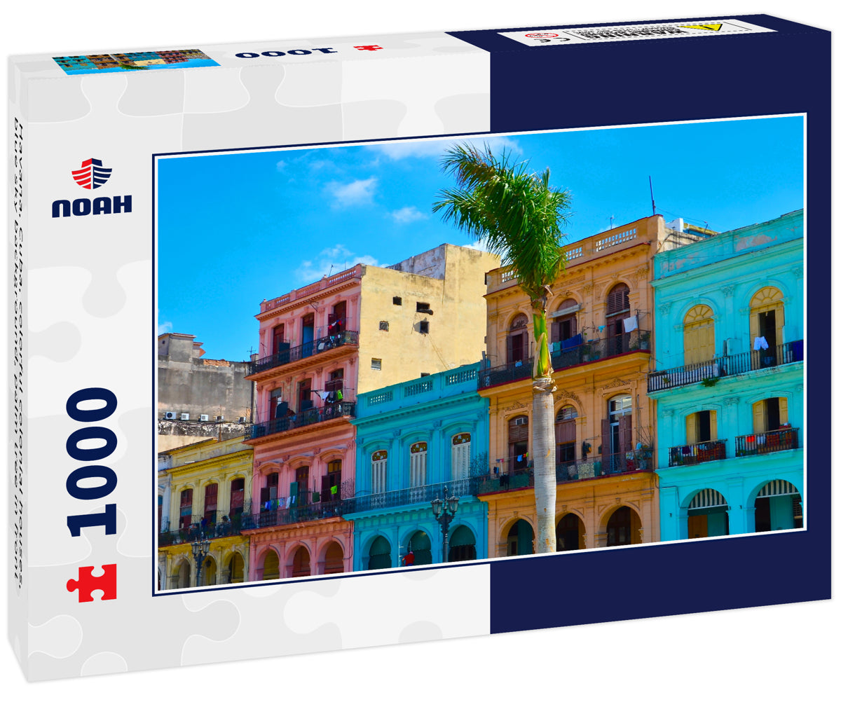 Havana, Cuba, colorful colonial houses, blue sky background, palm tree in front