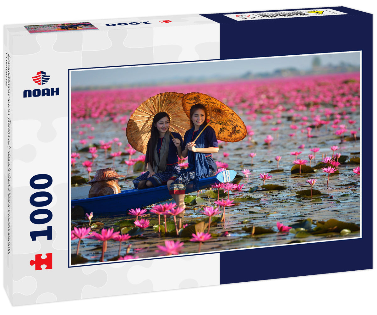 Laos woman in flower lotus lake, Woman wearing traditional Thai people , Red Lotus Sea UdonThani Thailand
