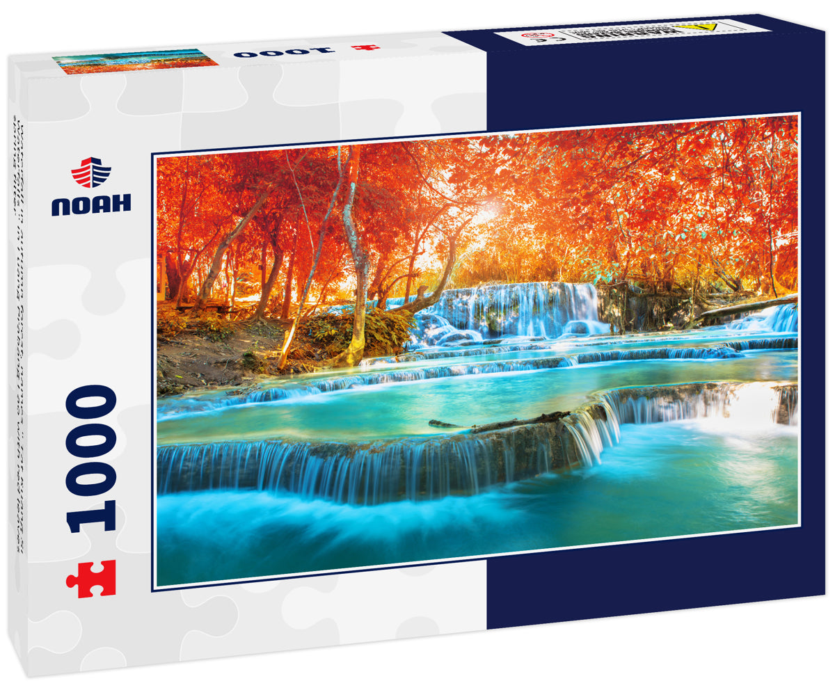 Waterfall in autumn forest, names " Tat Kuang Si Waterfalls " in Luang Prabang Lao with red leaves spring filter