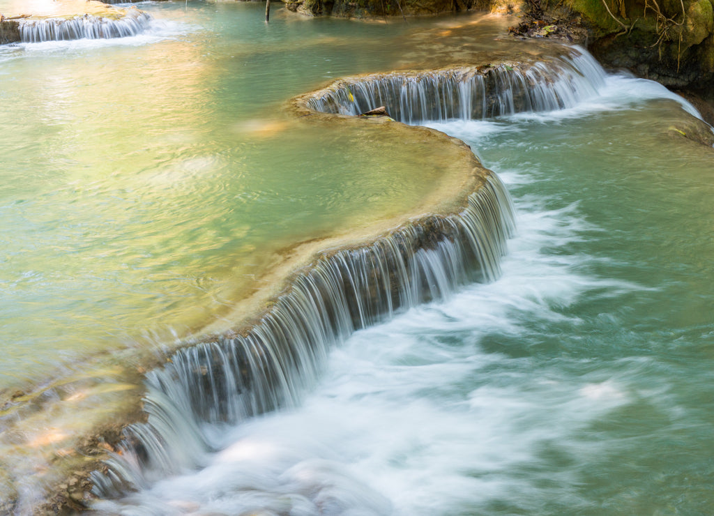 Beautiful landscape of Kuang Si falls an iconic popular waterfalls in the jungle park nearly Luang Prabang town, in north central Laos