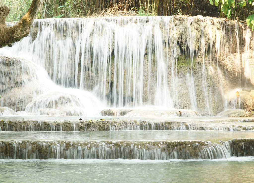 Kuang Si Waterfall and pools in tropical rain forest in Laos