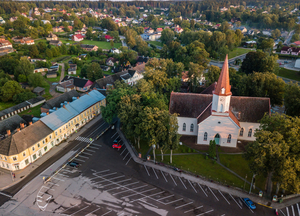 Aerial view of empty parking lot in city center in front of the church, Smiltene, Latvia