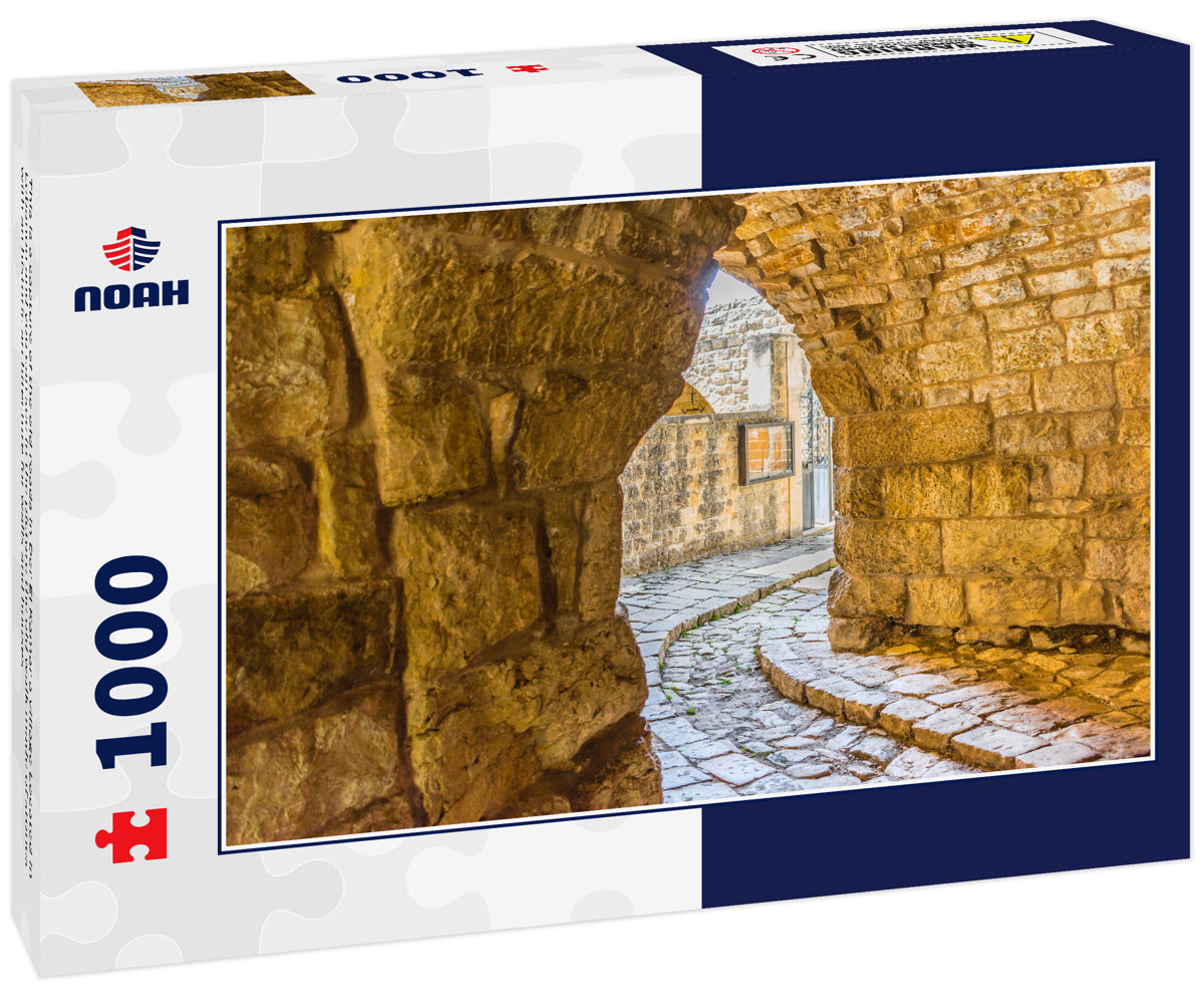 This is a capture of the old roads in Der El Kamar a village Located in Lebanon and you can see in the picture the old walk made of stones with an historic architecture for walls and houses