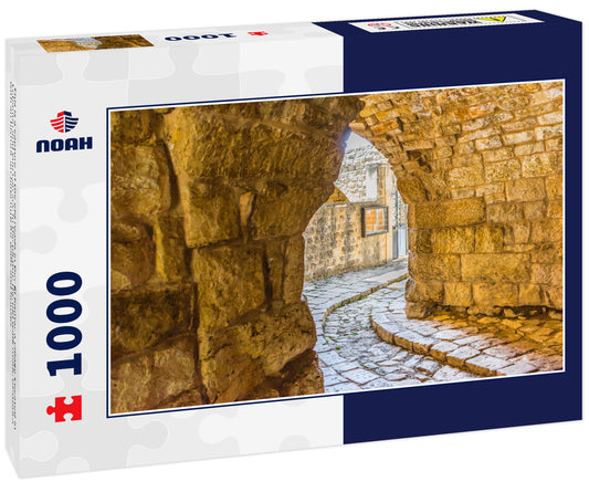 This is a capture of the old roads in Der El Kamar a village Located in Lebanon and you can see in the picture the old walk made of stones with an historic architecture for walls and houses