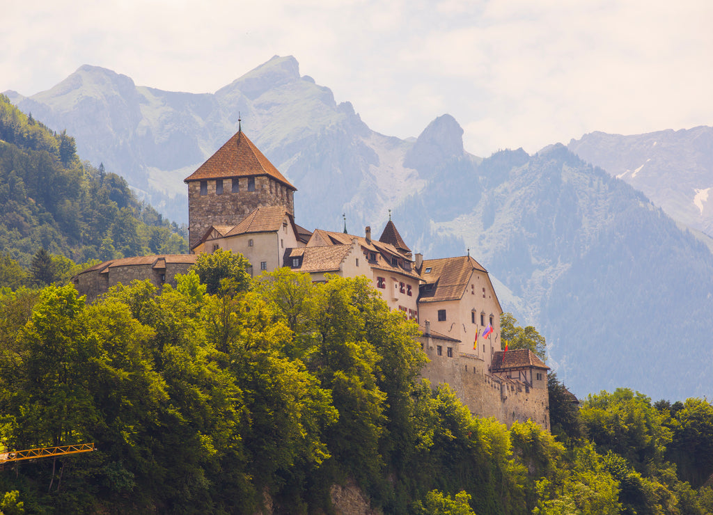 Liechtenstein Castle surrounded by Alps Mountains