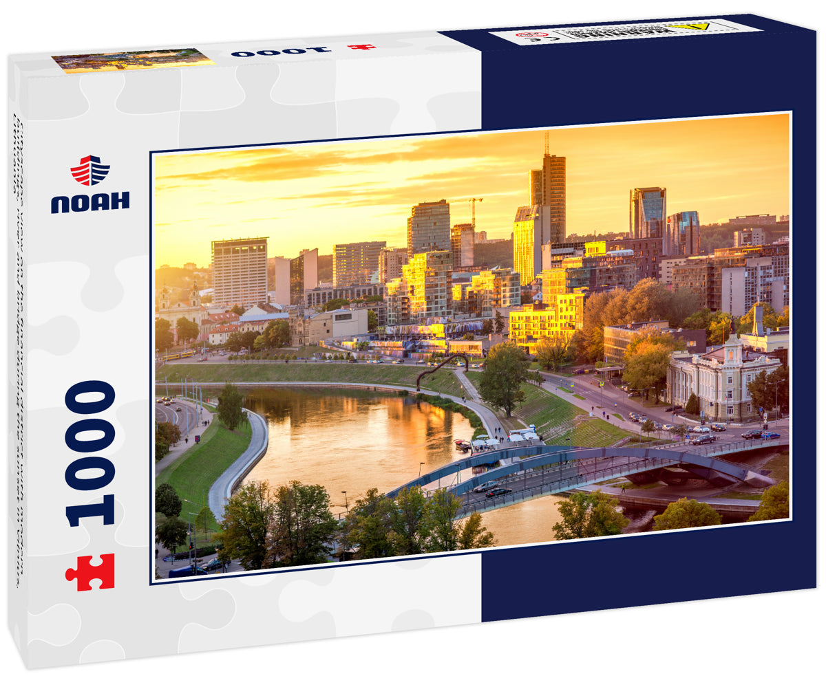 Cityscape view on the financial district with modern buildings, river and bridge during the sunset in Vilnius, Lithuania