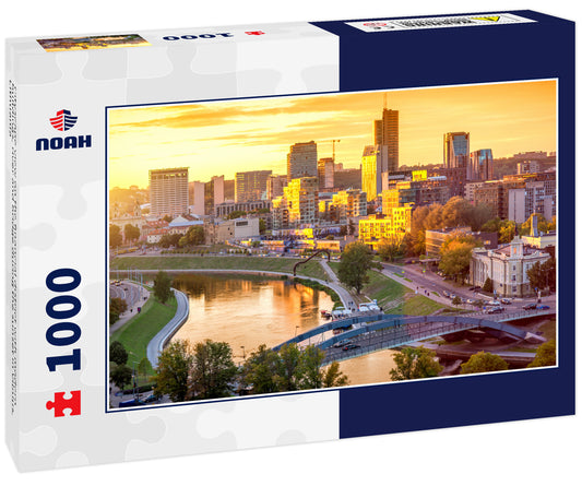 Cityscape view on the financial district with modern buildings, river and bridge during the sunset in Vilnius, Lithuania