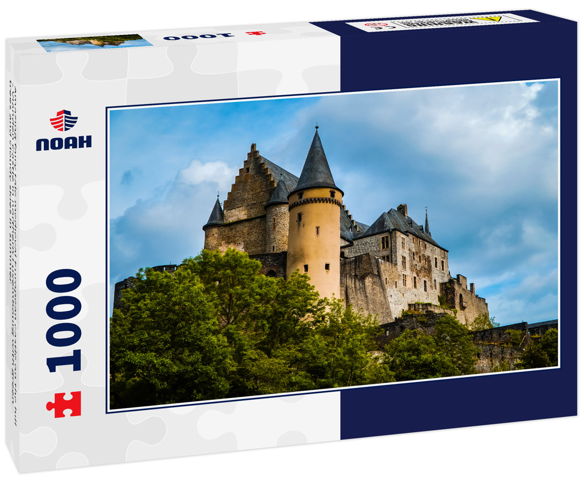 Amazing fairy tale medieval European castle on the hill - Vianden Castle in northern Luxembourg with green trees and cloudy skies in summer