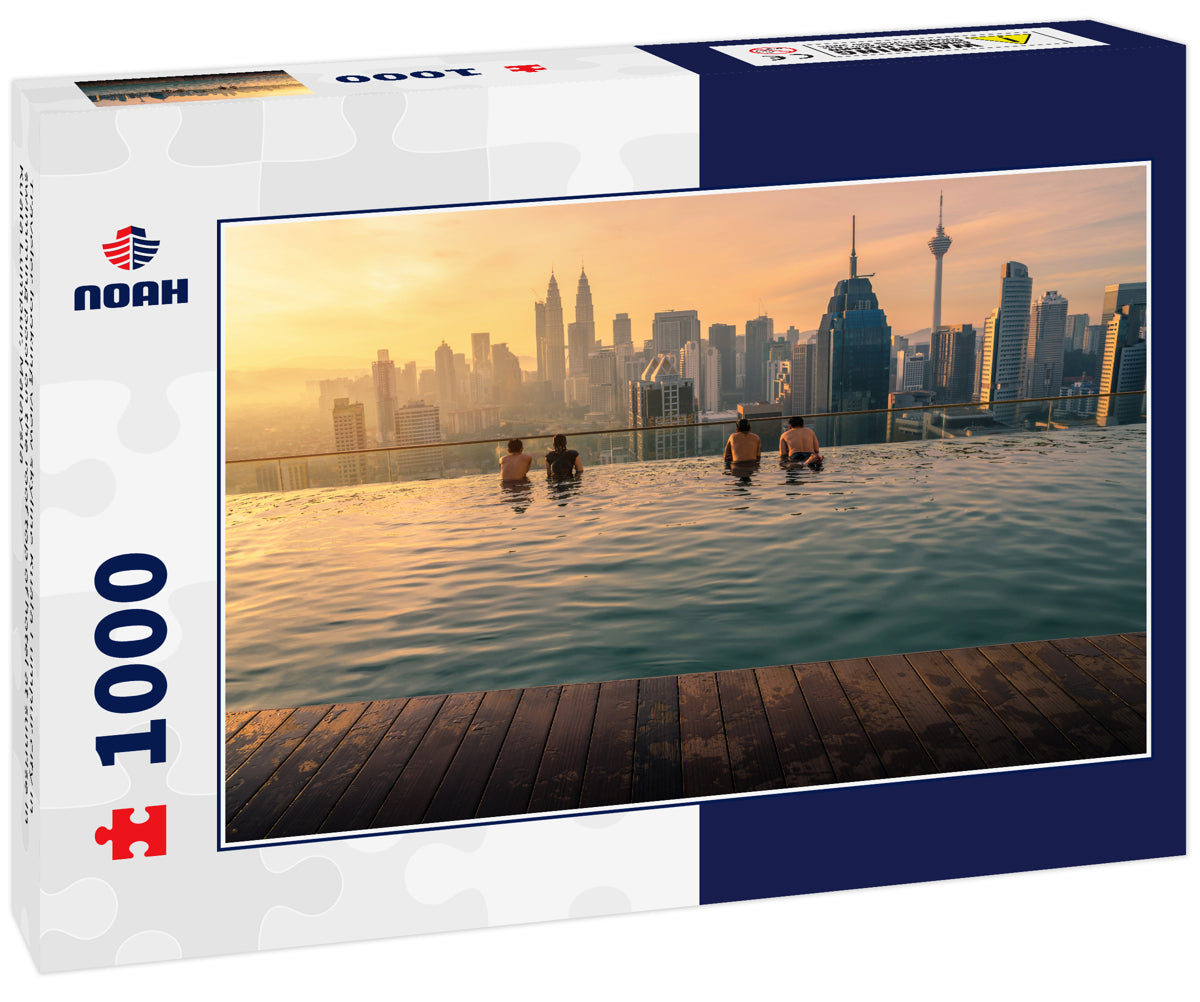 Traveler looking view skyline Kuala Lumpur city in swimming pool on the roof top of hotel at sunrise in Kuala Lumpur, Malaysia