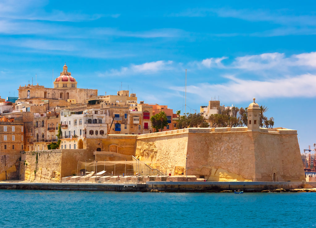Quay of Valletta with traditional Maltese building with colorful shutters and balconies in the sunny day, Valletta, Capital city of Malta