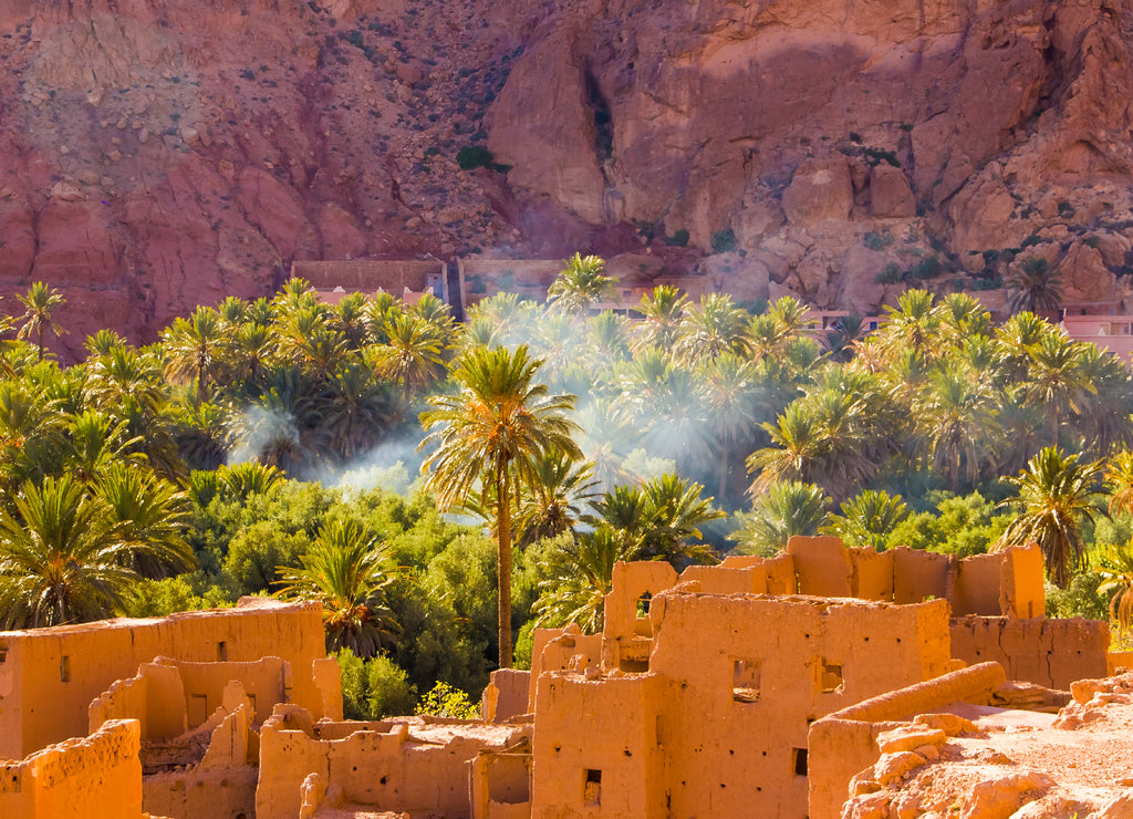 The ancient moroccan town near Tinghir with old kasbahs and high Atlas mountains in background, Tinghir, Morocco in Africa
