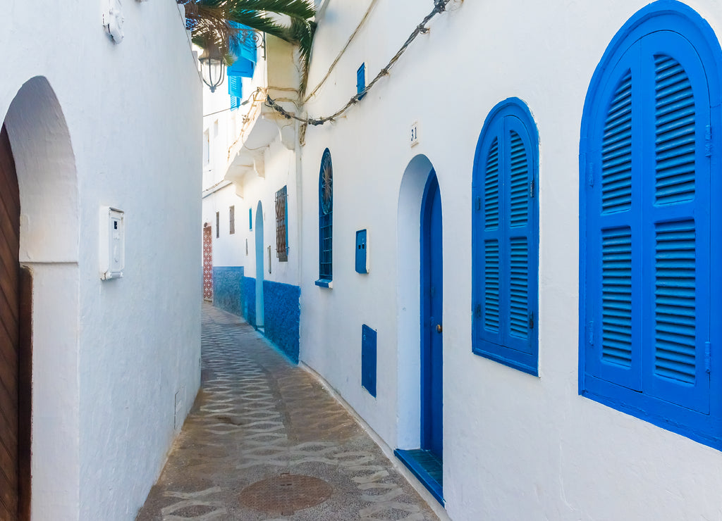 Beautiful street of white ancient medina of the Asilah village in Morocco