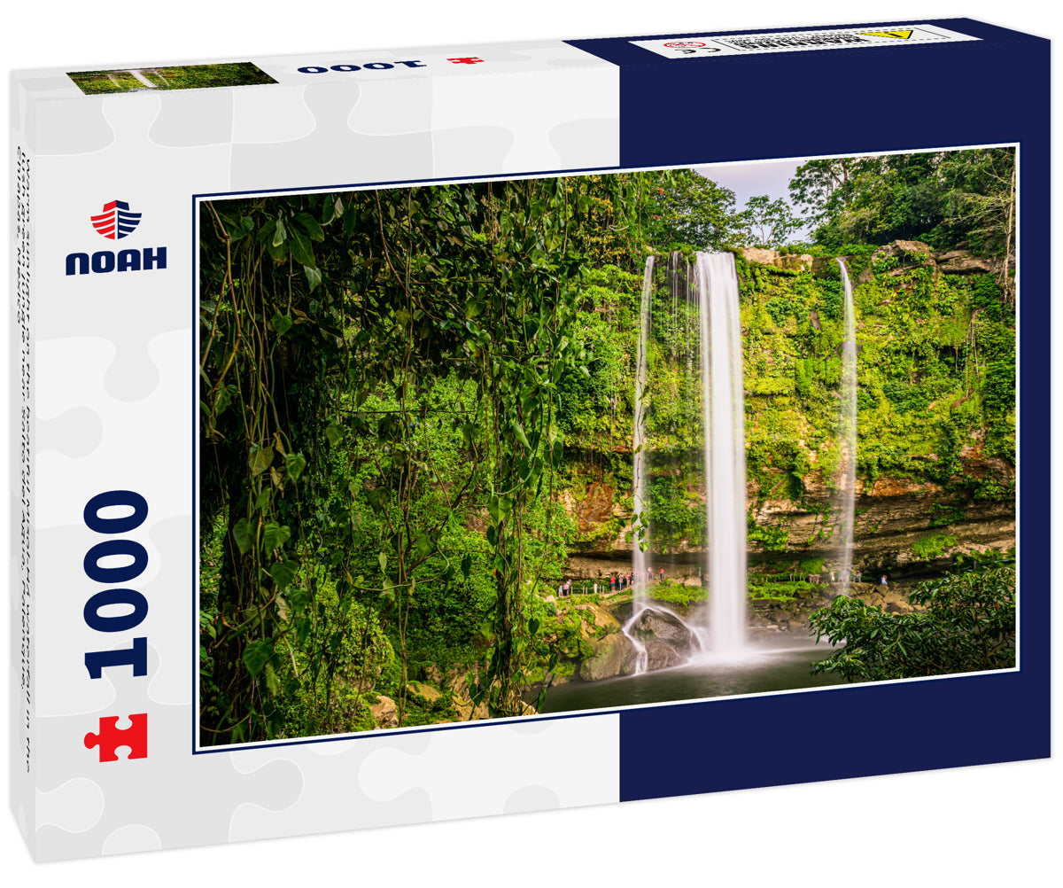 Warm sunlight on the beatiful Misol-Há waterfall in the lush green jungle near Salto del Agua, Palenque, Chiapas, Mexico