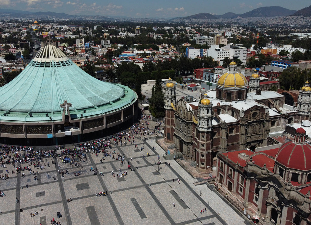 Basilica Virgin of Guadalupe with a lot of visitors during a sunny weekend in Mexico City, Mexico