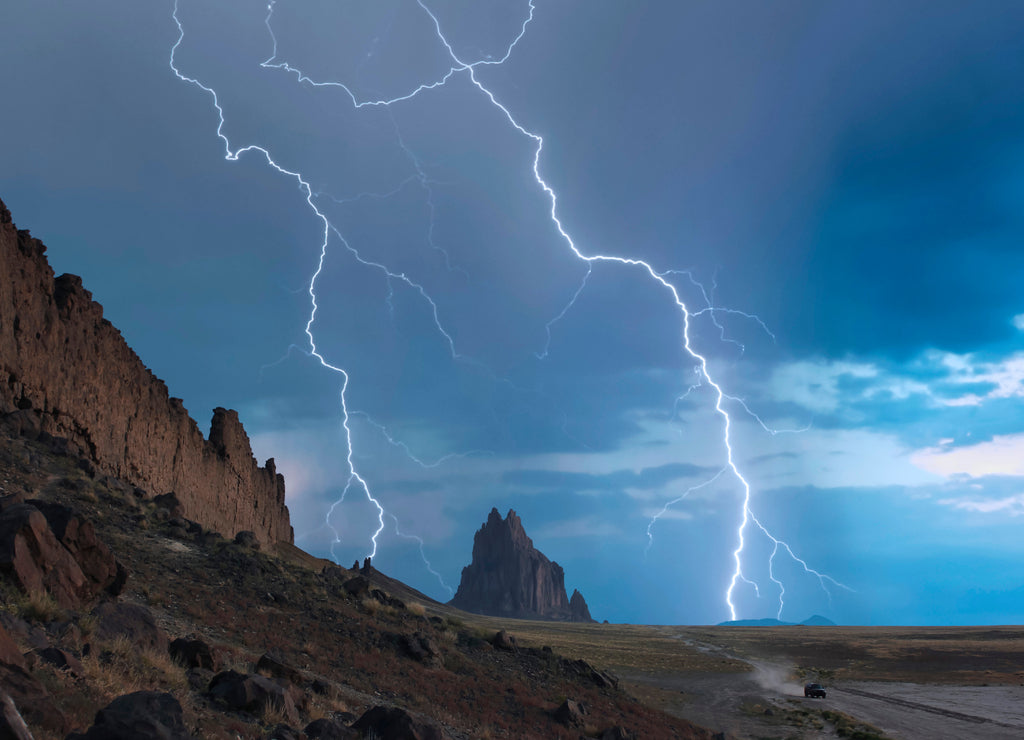 An SUV Races Away from a Thunderstorm at Shiprock, New Mexico