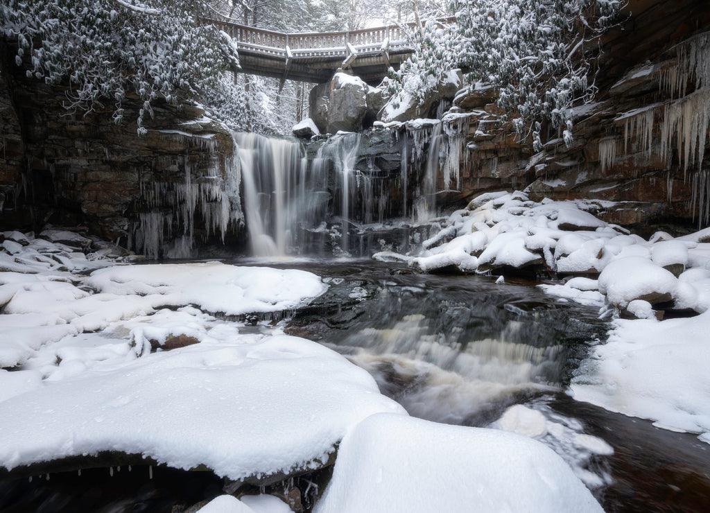 A wintery scene at Elakala Falls in West Virginia under soft afternoon light