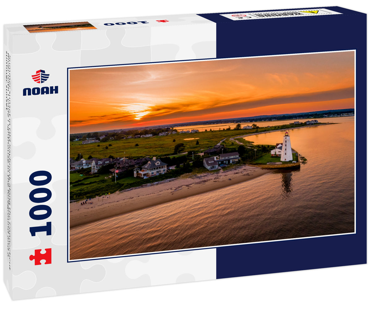 Summer sunset in Old Saybrook along the Connecticut River with Lynde Lighthouse in the foreground and a summer sunset