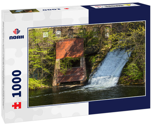 Water power sluice emerges from historic Dart's Stone Mill on the Hockanum River in Rockville, Connecticut