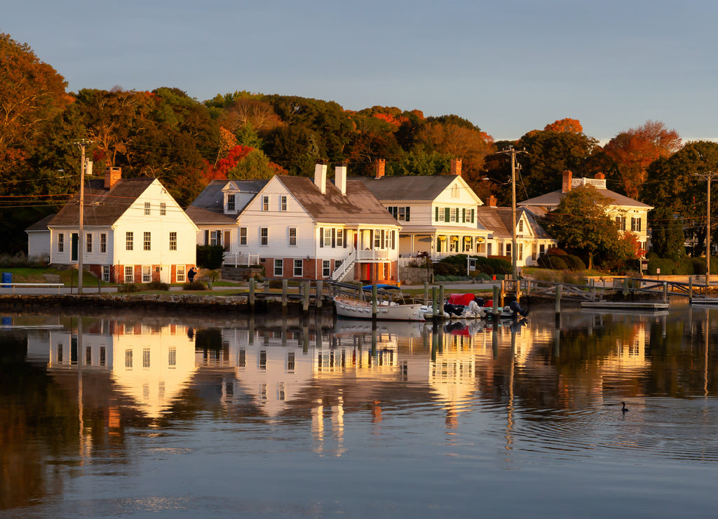 Panoramic view of residential homes by the Mystic River during a vibrant sunrise. Taken in Mystic, Stonington, Connecticut, United States
