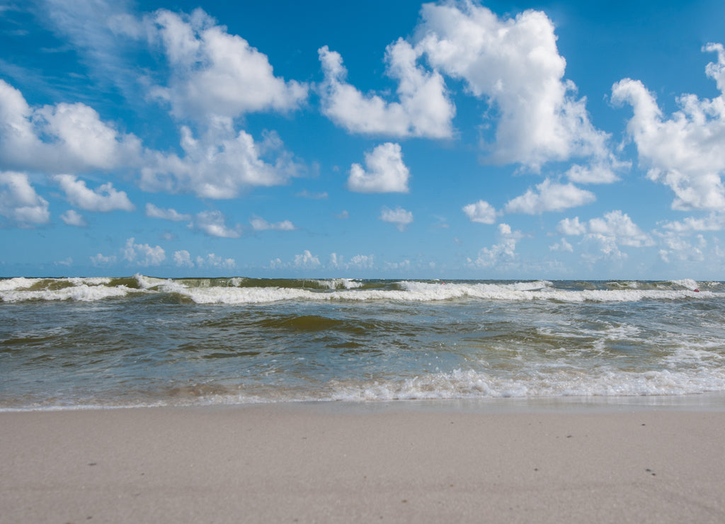 Blue sky and waves on beach at Gulf Shores Alabama