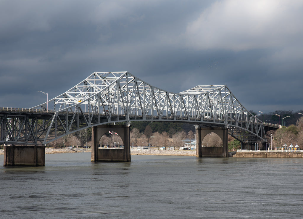 Historic O'Neal Bridge a cantilevered warren truss steel bridge over the Tennessee River with dramatic sky Alabama