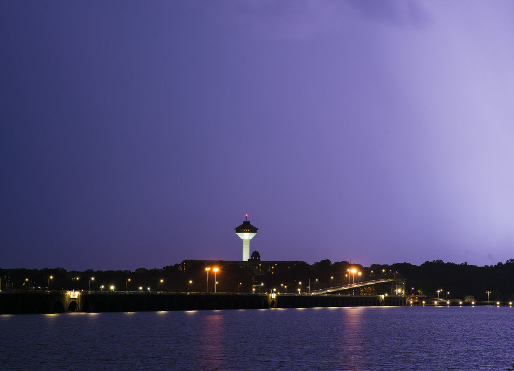 Bright Lightning Strike over the Tennessee River Near Wilson Dam and the Renaissance Tower in Florence Alabama