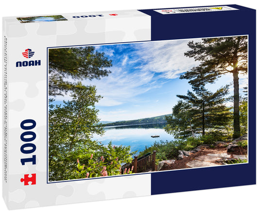 Merrymeeting Lake with early morning sun peeking through the trees, New Hampshire