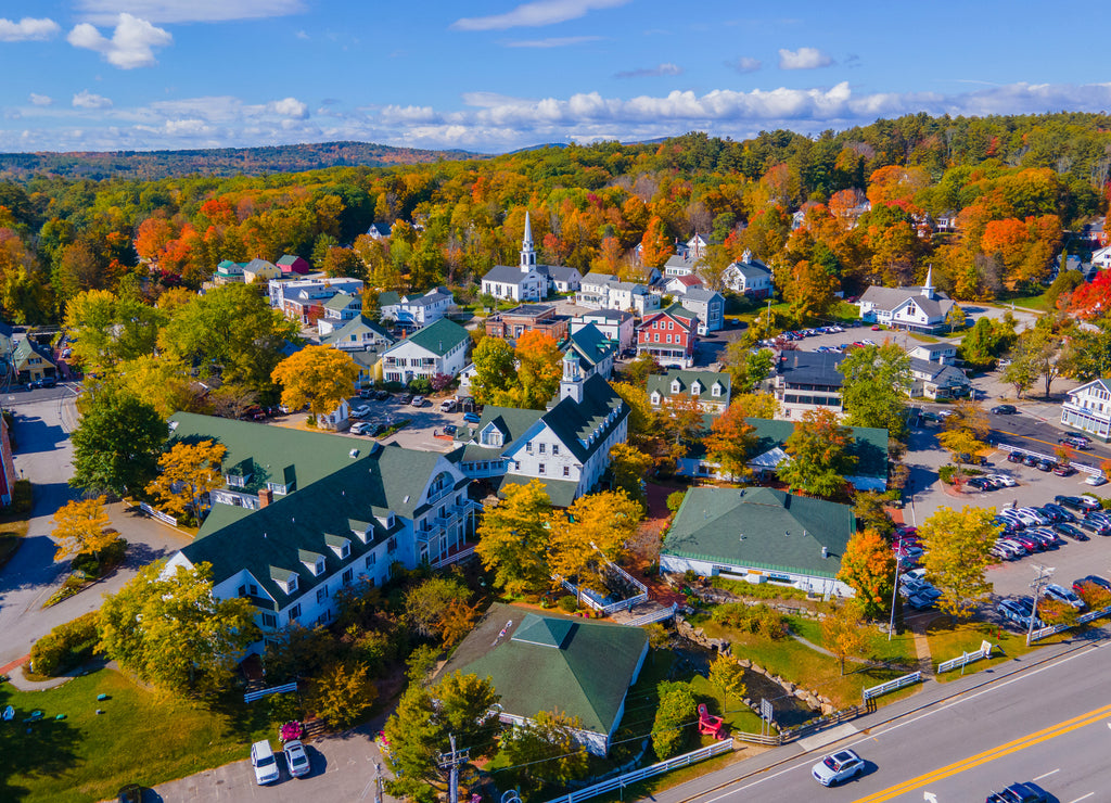 Meredith town center with fall foliage aerial view including First Congregational Church and Mill Falls, New Hampshire, USA