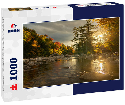 The sun light is soften by trees in fall colors and reflected in the river water narrow, East fork Pemigewasset River, White Mountain NF, New Hampshire