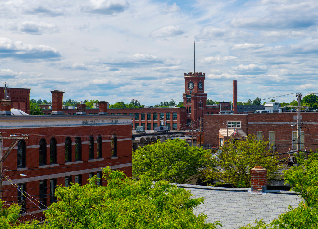 Historic mill buildings by Nashua River in Nashua, New Hampshire, USA