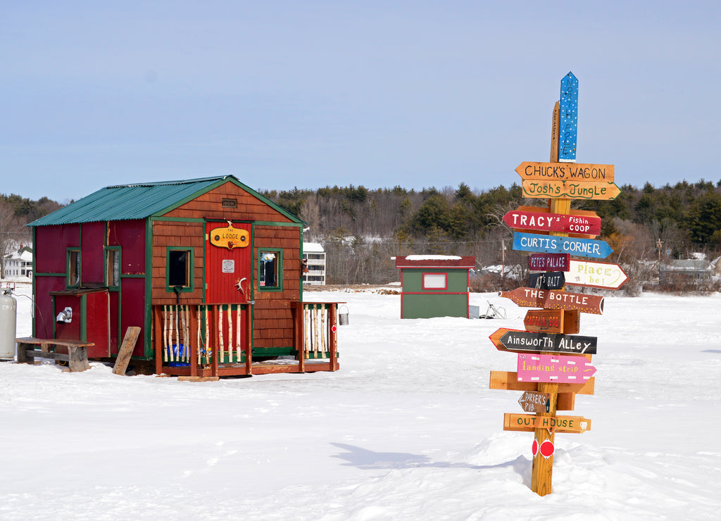 Signs point the way to a multitude of ice fishing shacks on Lake Winnipesaukee, New Hampshire