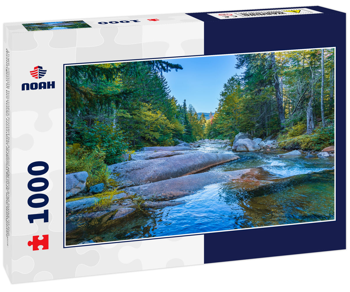 Huge smooth boulders honed by ancient glaciers and flows of the Ammonoosuk mountain river near a waterfall in the foothills of Mount Washington in the White Mountain National Forest, New Hampshire